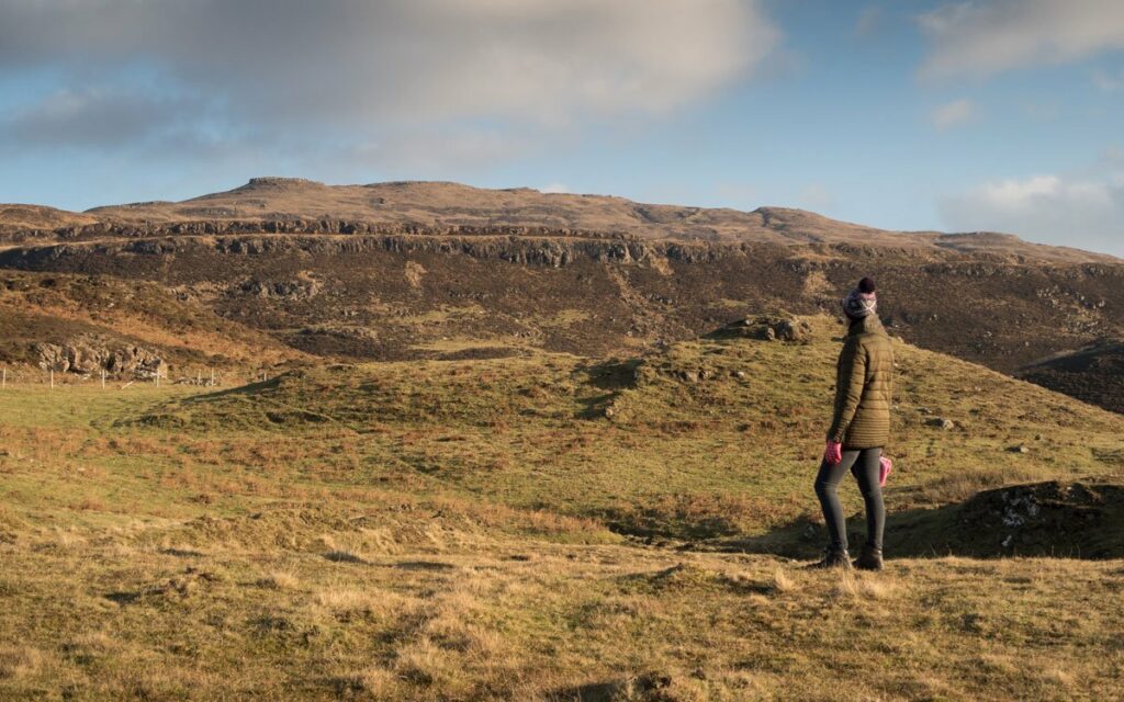 Walker looking to summit of Beinn na Drise