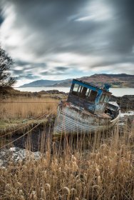An old boat at rest on the shore of Loch Scridain