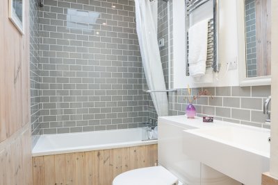 Family bathroom with bath and shower over