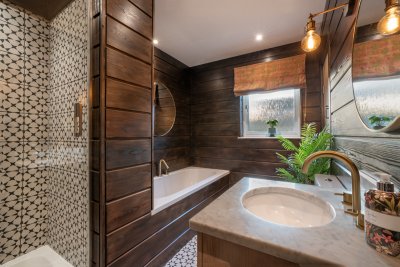 The ground floor family bathroom offers plenty of wow factor