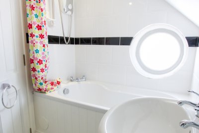 The en-suite bathroom to the master double also has a combed ceiling, making it less well suited to taller guests