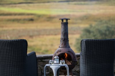 The cosy fire pit and outdoor sitting area is ideal for sunset views