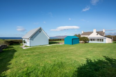 Balmeanach Farmhouse enjoys a private position within extensive gardens with a superb sea view