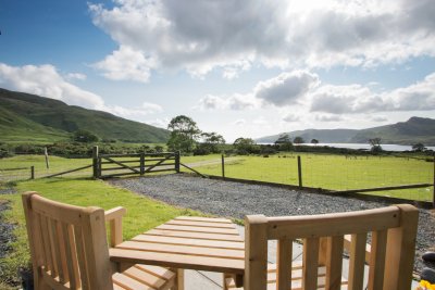 Garden with seating and sea views at the Bothy