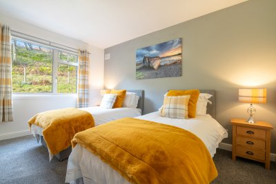 Doze off in the luxurious twin bedroom, complete with its own en-suite