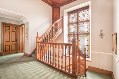 Landing with stained glass window on the first floor