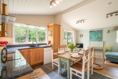 Looking across the open plan kitchen, dining and living space at the cabin