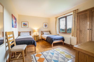The spacious twin bedroom offers ample storage space