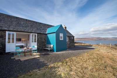 Cottage exterior.  Private setting with fenced garden and wonderful sea views