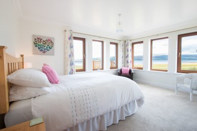 Wake up to the changing tides from the spacious master bedroom