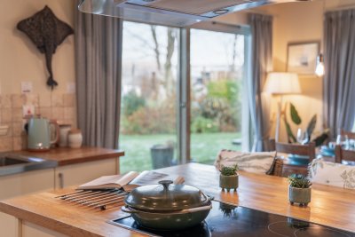 Lovely garden and sea views frame the living and kitchen areas