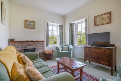 The cosy living room at Hazelbank Cottage