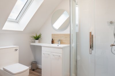 This shower room serves the upstairs double bedroom