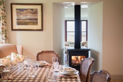 Get cosy by the stove at mealtimes