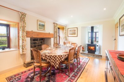 The dining room shares the cosy double sided stove 
