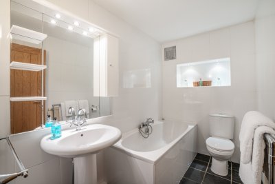 The ground floor bathroom offers guests comfort and ease