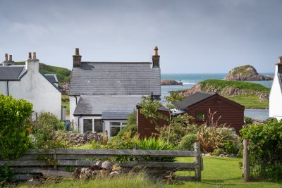 Maple Cottage is one of a row of stone cottages hugging the bay