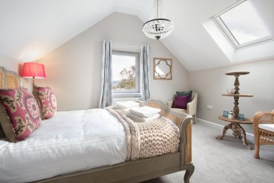 Vaulted ceilings add character and an airy feel to the bedrooms