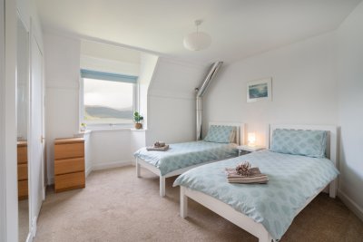 The welcoming twin room complete with sea views