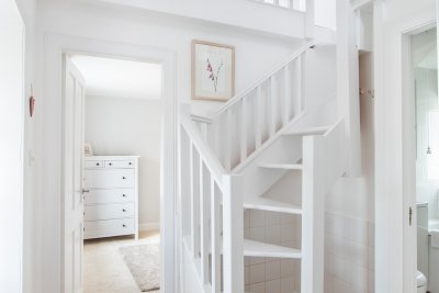 The second double bedroom lies up this steep, winding staircase, a room with coombed ceilings