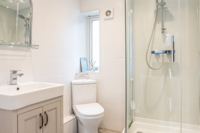 The contemporary shower room at Ploughman's Cottage promises a pampering experience despite the property's wild location