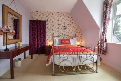 The double bedroom with sloping wall and lovely views