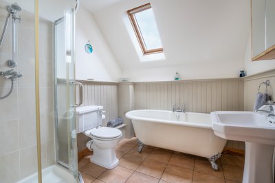 The roll-top bath tub makes an indulgent feature in the family bathroom