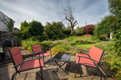 Soak up the sunshine from the garden sitting area in the heart of Tobermory's old town