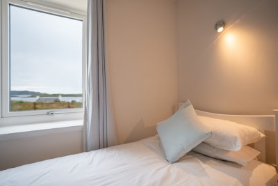 Enjoy the sea views from the twin bedroom