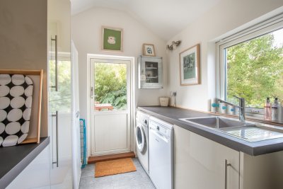 The well equipped utility room promises home-from-home amenities
