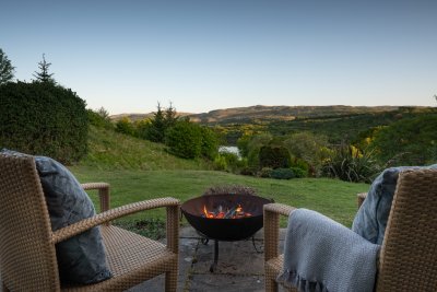 Soak up the views and reminisce about the day's highlights around the fire bowl with a dram or two