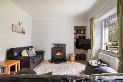 The living room is filled with light and a cosy space year-round
