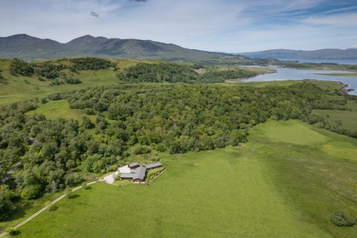 A bird's eye view of Auchnacraig Lodge and its setting close to the sea