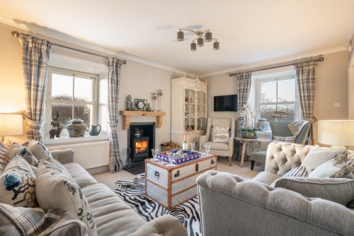 Light the wood burning stove and relax in the beautifully presented living room