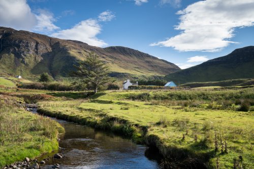 Stunning scenery surrounds Balmeanach Farmhouse, with burns, sea, cliffs and mountains as far as the eye can see