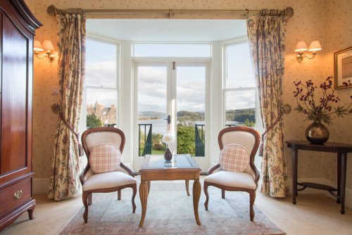French doors in the master bedroom with stunning views of the harbour and Morven beyond