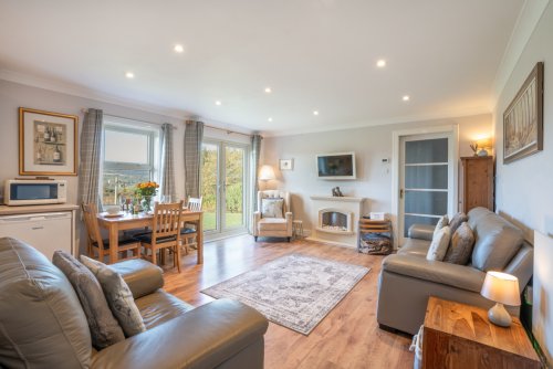 Open plan living area with double doors to the garden