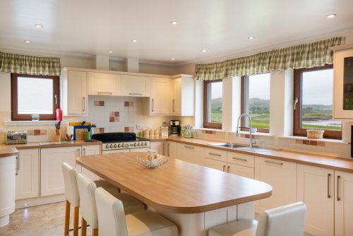 The lovely breakfast bar offers a superb view in this spacious kitchen