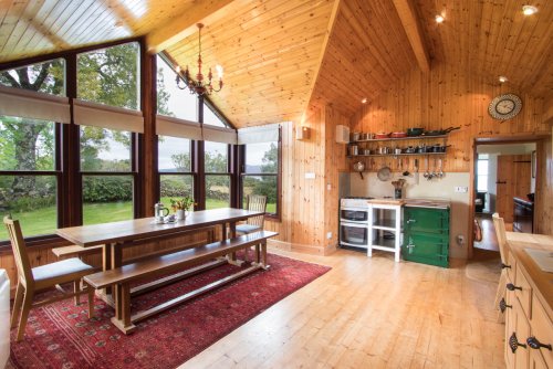 Light filled kitchen in the farmhouse with large feature window