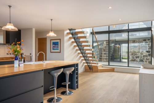 The open-plan living area at Mor Aoibhneas is filled with natural light
