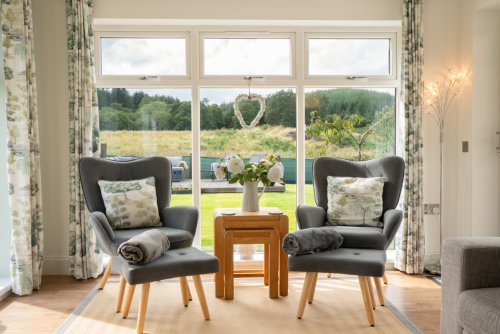 Enjoy the cosy sitting nook with glorious garden views