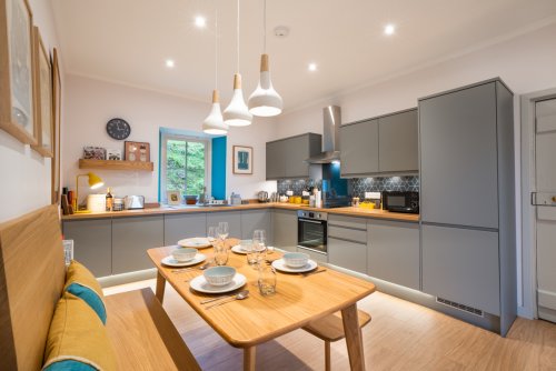 Pull up a bench in the dining kitchen, which is superbly equipped for delicious home cooking