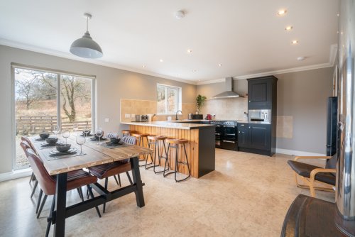 Enjoy a social feel with a breakfast bar and dining kitchen with wood burning stove
