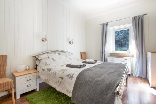 The spacious double bedroom promises a restorative night's sleep